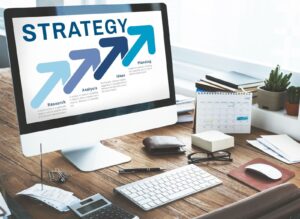 laptop showing the word strategy
